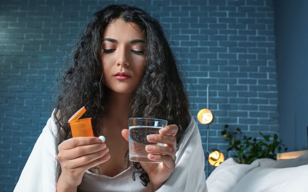 woman taking at-home abortion pills